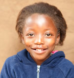 portrait photo of Tikho, a young Zambian girl